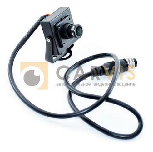 Миниатюрная черная камера видеонаблюдения CARVIS MC-423 с регулируемым объективом и зеленым фильтром на передней панели, закрепленная на регулируемой опоре с возможностью крепления к различным поверхностям.